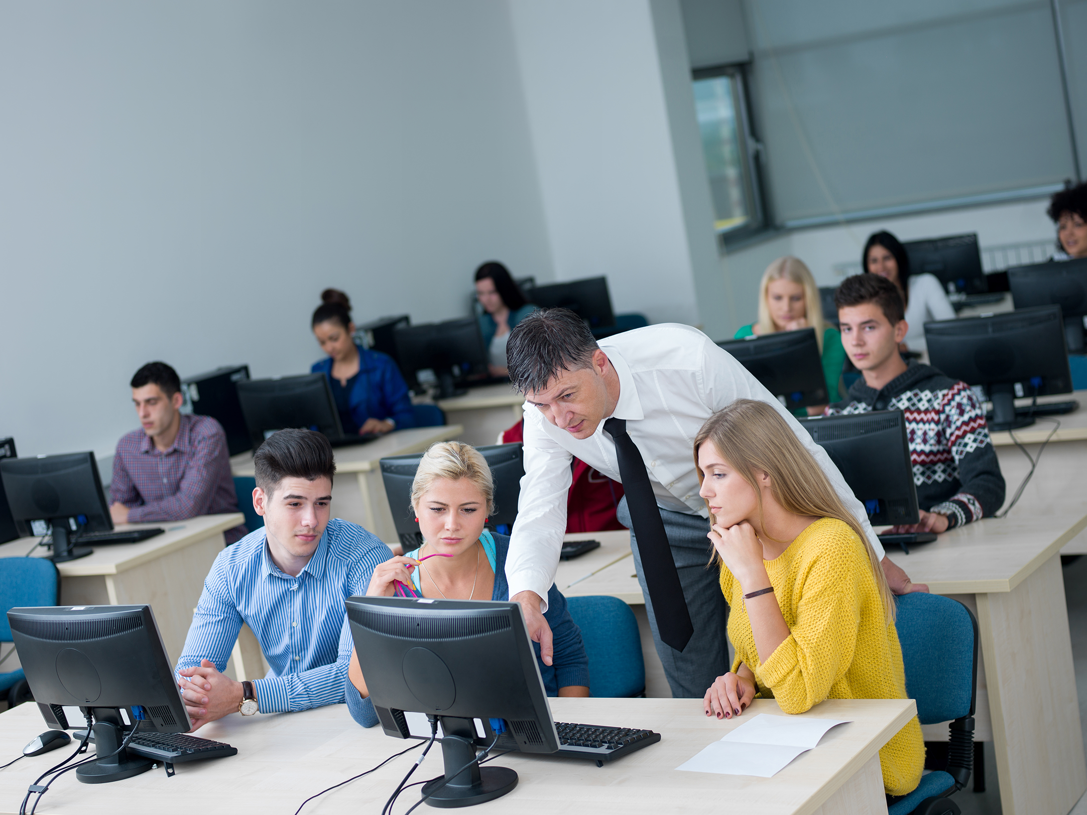 students-with-teacher-in-computer-lab-classrom